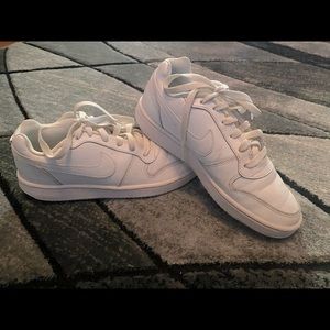 White woman’s NIKE shoes